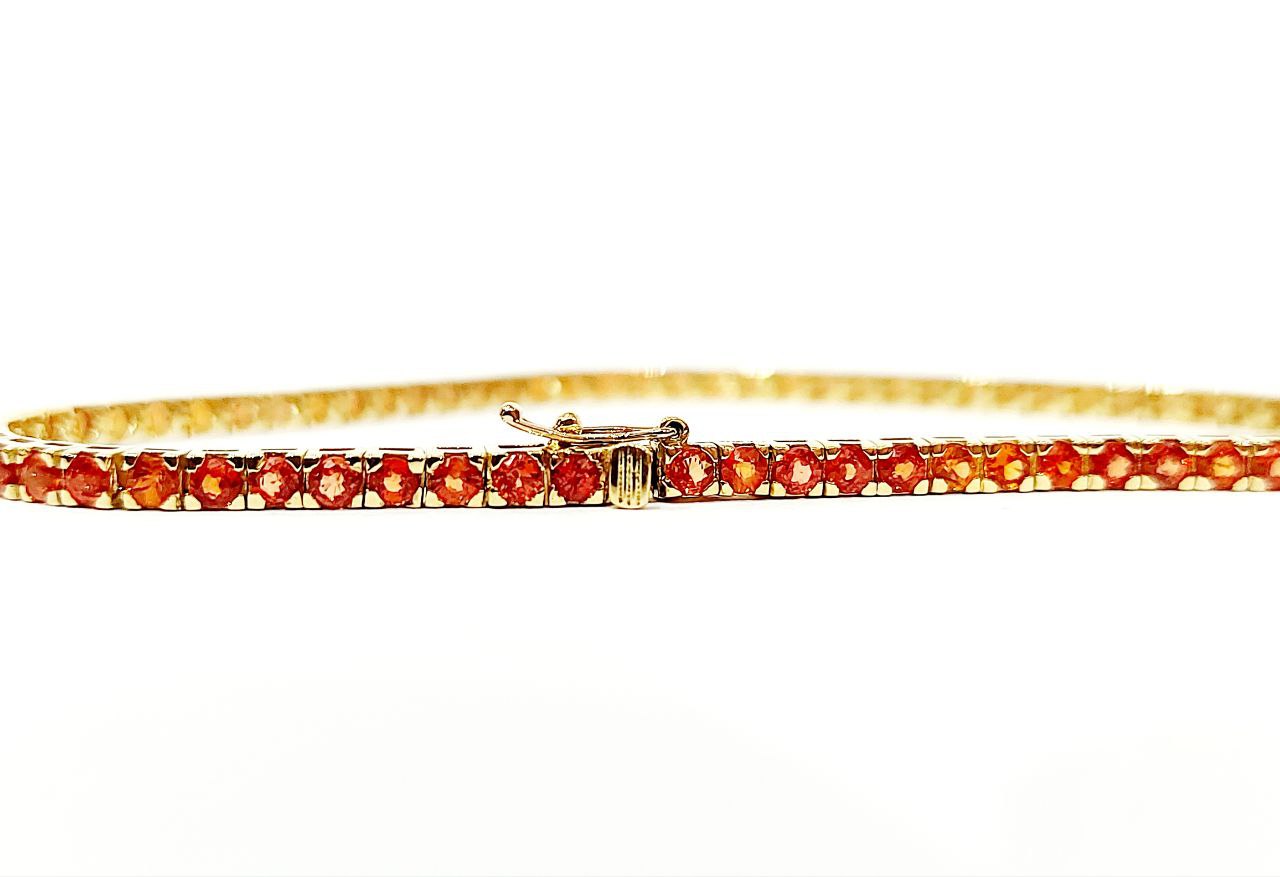 Bracciale tennis tornito con Zaffiri arancioni 5,40 ct in Oro Giallo 18 kt (750)
