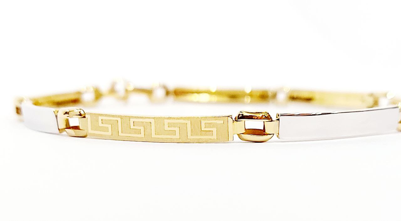 Bracciale Oro bianco e Oro Giallo 18 kt (750) targhette con greca lavorate - Oreficeria