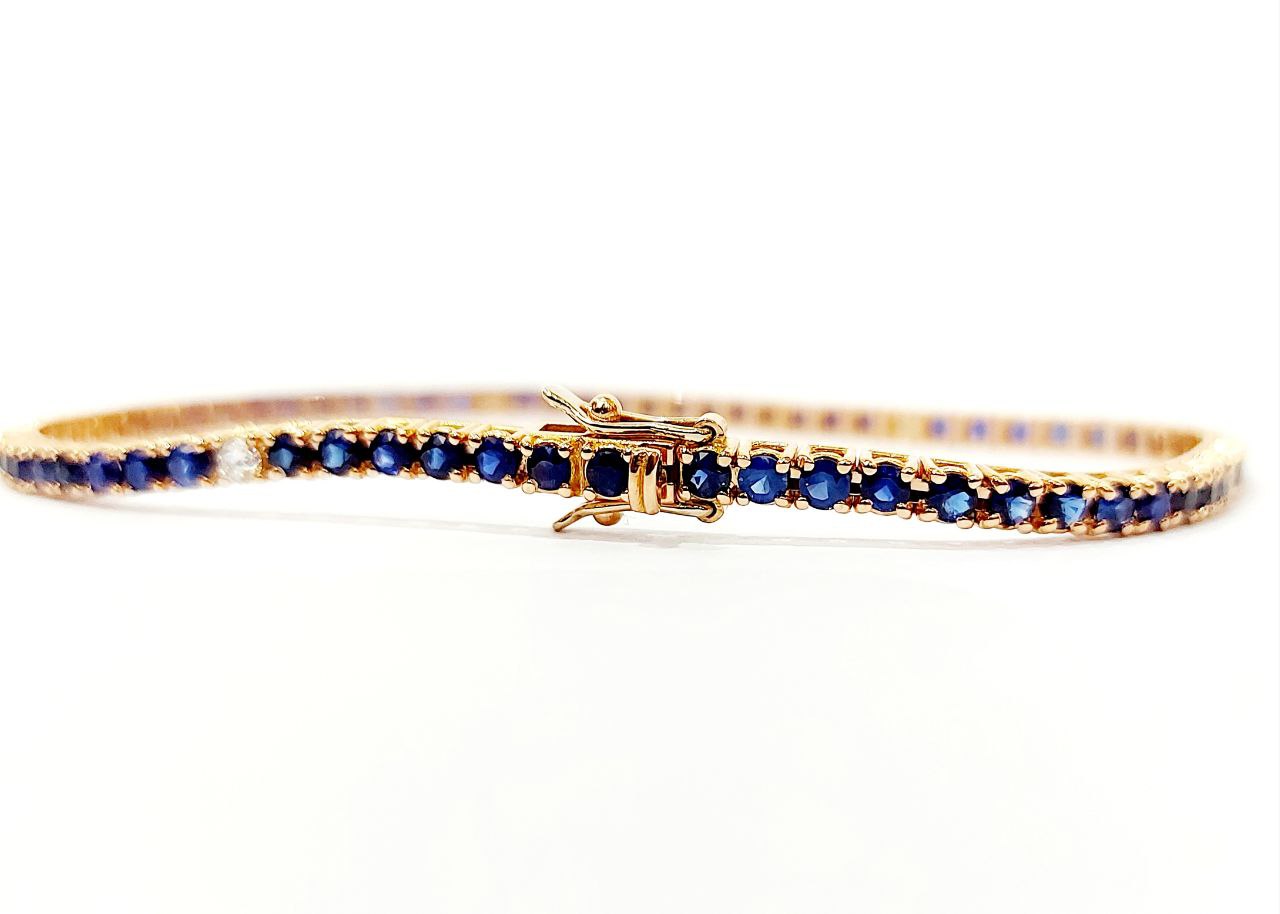 Bracciale modello Tennis Oro Rosa 18kt-750 Diamanti ct 0,27 ct e Zaffiri blu 4,54 ct