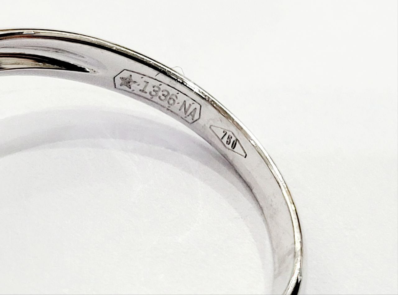 Anello modello fantasia con Smeraldo Ovale ct 0,58 e contorno di Diamanti ct 0,66 Oro 18kt-750