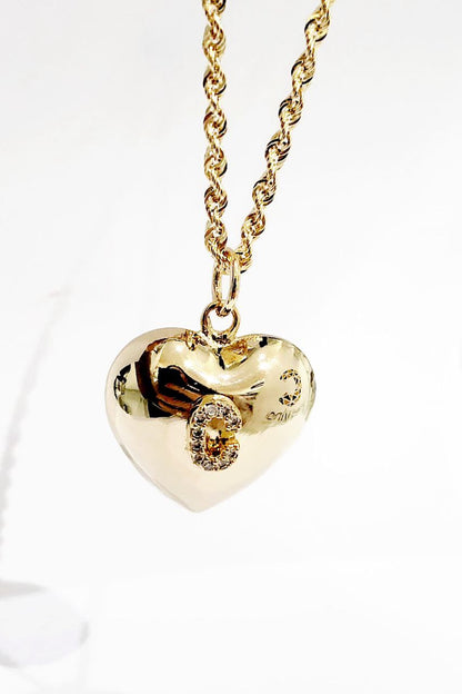 Collana cuore bombato in oro 18 kt con lettera personalizzata in diamanti ct 0,14