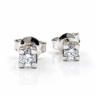 Orecchini punto luce tornito con diamanti ct 0,60 in oro bianco 18Kt (750)