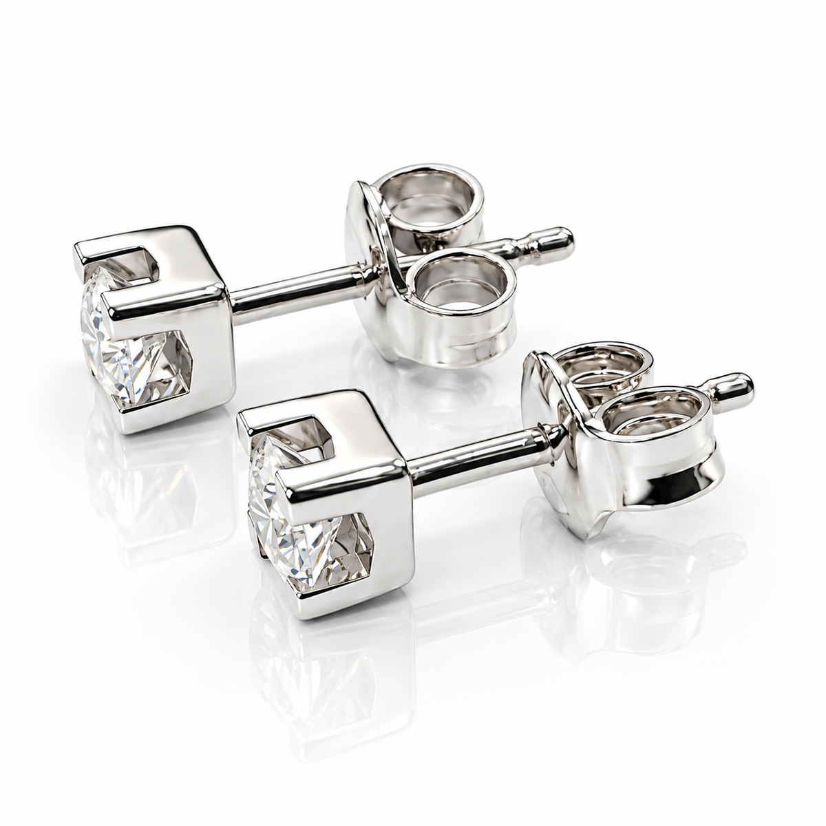 Orecchini punto luce tornito con diamanti ct 0,60 in oro bianco 18Kt (750)
