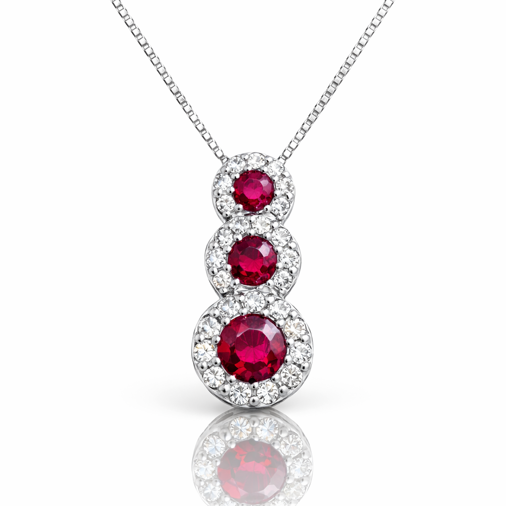 Collana con pendente trilogy magic con rubini ct 0,60 e diamanti ct 0,22 in oro bianco 18kt (750)