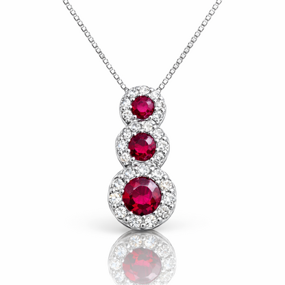 Collana con pendente trilogy magic con rubini ct 0,60 e diamanti ct 0,22 in oro bianco 18kt (750)
