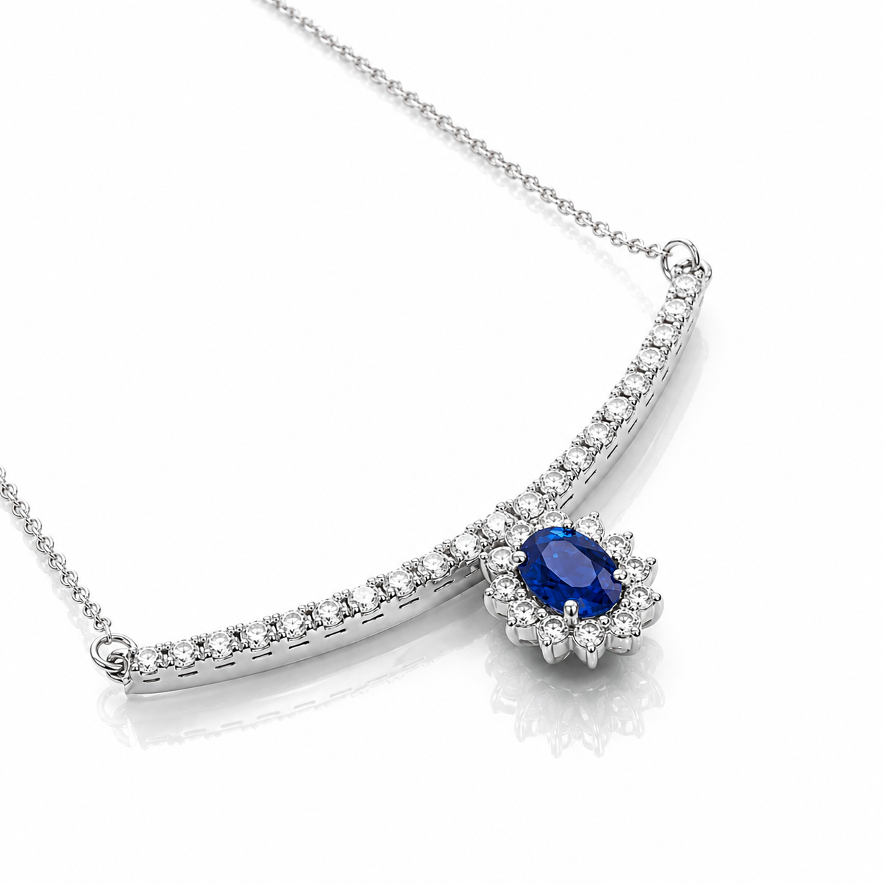 Collana "sorriso" pendente con zaffiro blu ct 0,66 e diamanti ct 0,52 in oro bianco 18kt (750)