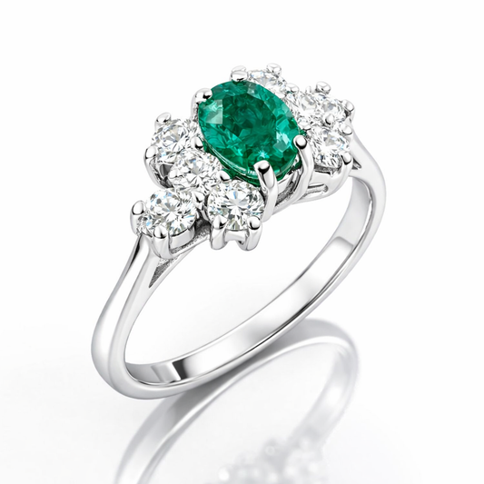 Anello con smeraldo ovale centrale ct 0,45 e diamanti ct 0,32 in oro bianco 18kt (750)