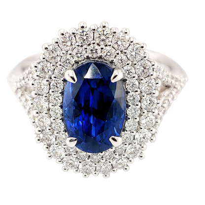 Anello in oro bianco 18K con doppio contorno di diamanti ct 1,12 e zaffiro blu ovale Ct 3,35