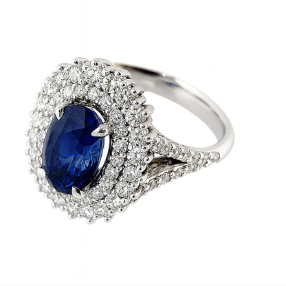 Anello in oro bianco 18K con doppio contorno di diamanti ct 1,12 e zaffiro blu ovale Ct 3,35