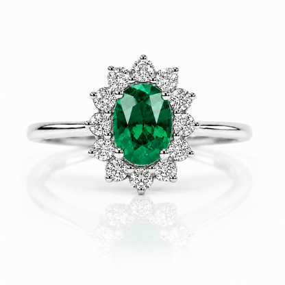 Anello con smeraldo ovale ct 0,55 e diamanti ct 0,20 in oro bianco 18kt (750)