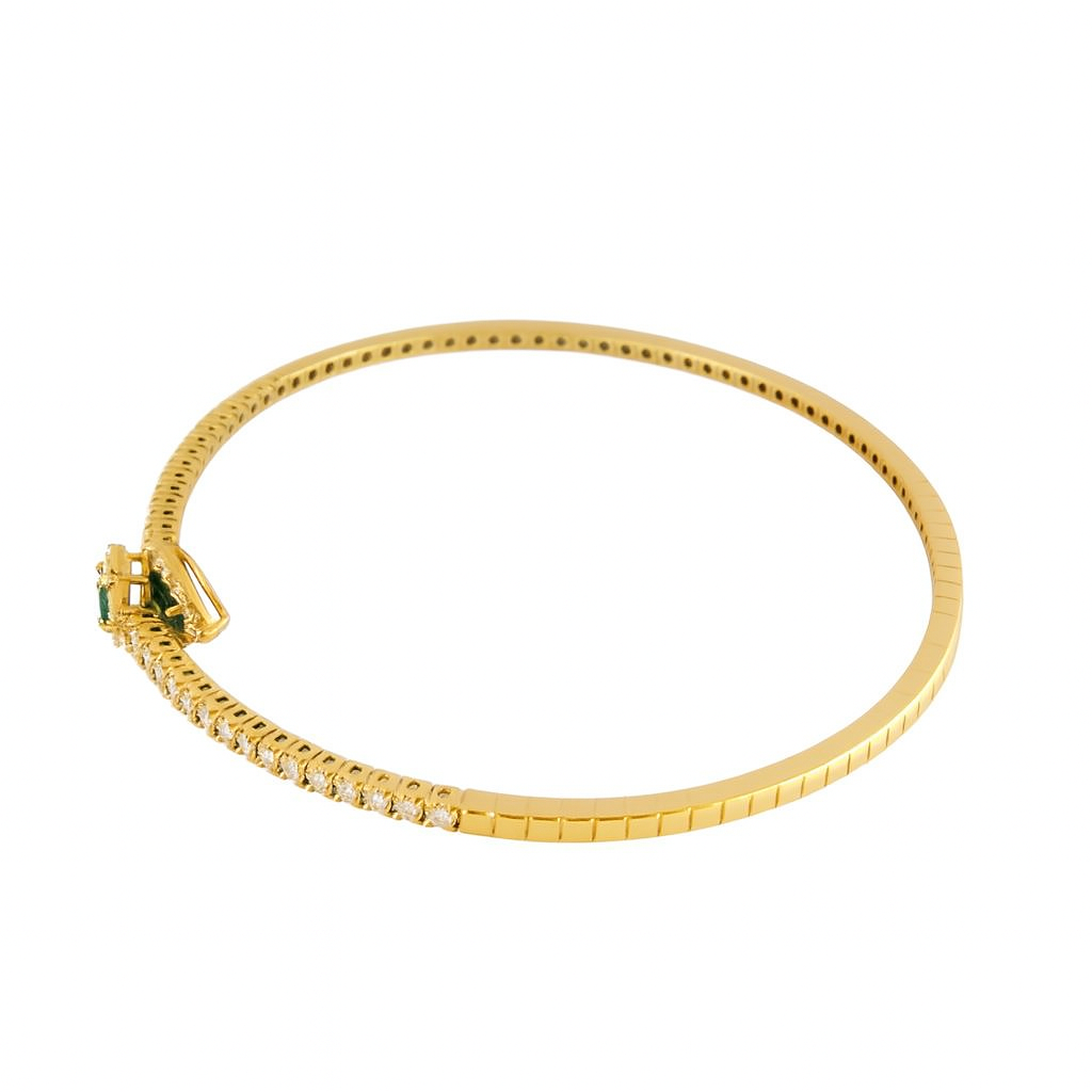 Bracciale a molla contrarié “Astralia” in oro giallo 18Kt con smeraldi 0,77 ct e diamanti 0,92 ct