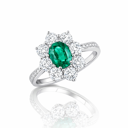 Anello con Smeraldo Ovale ct 0,58 e contorno di Diamanti ct 0,66 in oro bianco 18kt (750)