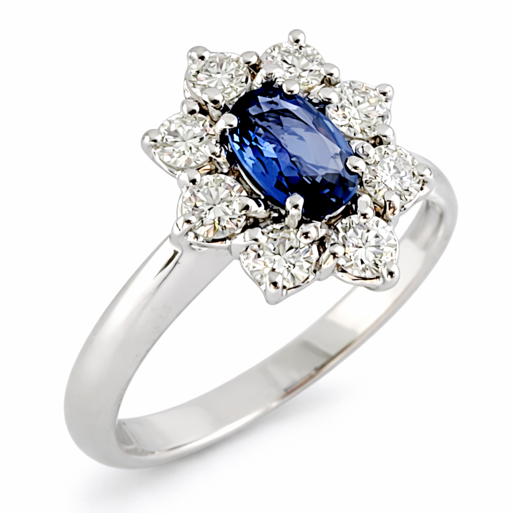 Anello modello "Lady Diana" Diamanti ct 0,48 e Zaffiro centrale ct 0,65 in oro bianco 18kt (750)