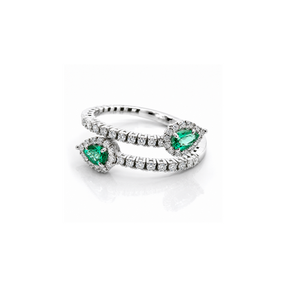 Anello contrarié "Astralia" con diamanti ct 0,50 e smeraldi a goccia ct 0,60 in oro bianco 18kt (750)