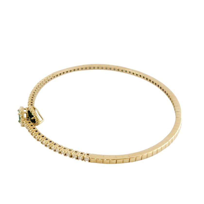 Bracciale a molla contrarié “Astralia” in oro giallo 18Kt con smeraldi 0,77 ct e diamanti 0,92 ct