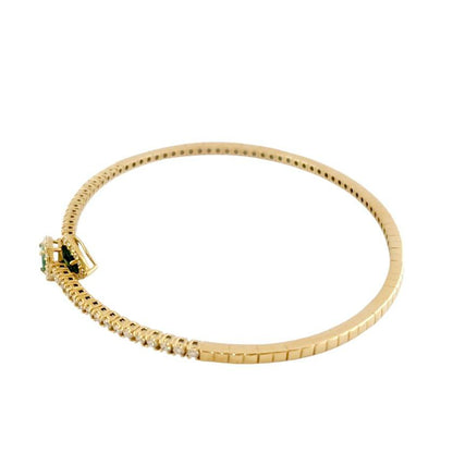 Bracciale a molla contrarié “Astralia” in oro giallo 18Kt con smeraldi 0,77 ct e diamanti 0,92 ct