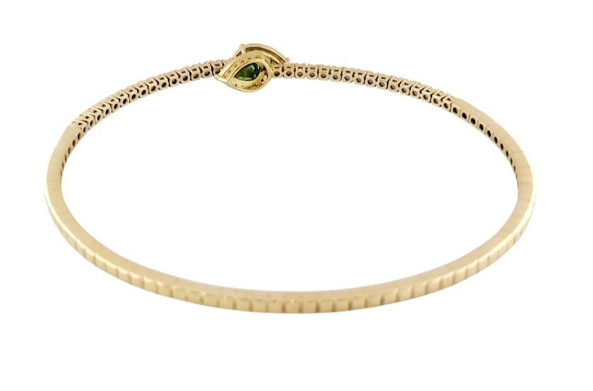 Bracciale a molla contrarié “Astralia” in oro giallo 18Kt con smeraldi 0,77 ct e diamanti 0,92 ct