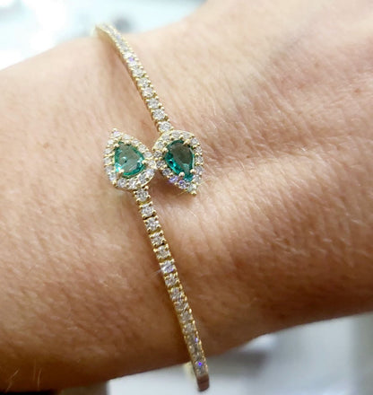Bracciale a molla contrarié “Astralia” in oro giallo 18Kt con smeraldi 0,77 ct e diamanti 0,92 ct