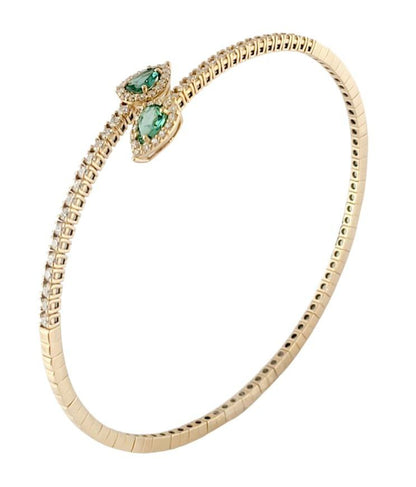 Bracciale a molla contrarié “Astralia” in oro giallo 18Kt con smeraldi 0,77 ct e diamanti 0,92 ct