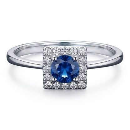 Anello fantasia quadrato con Zaffiro ct 0,25 e contorno di Diamanti ct 0,16 in Oro Bianco 18kt (750)